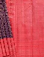 Red Kanchipuram silk saree with intricate zari border and traditional motifs