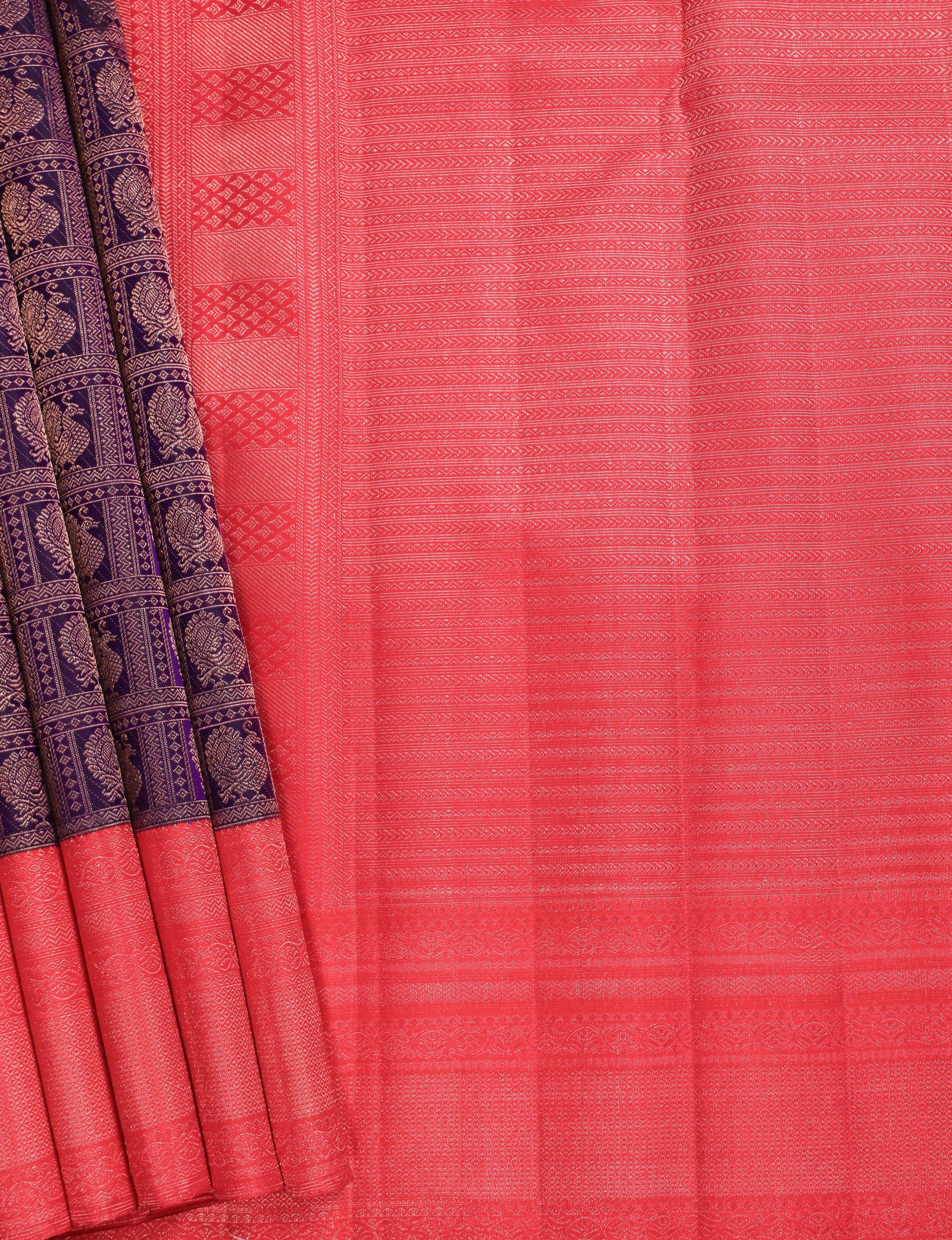 Red Kanchipuram silk saree with intricate zari border and traditional motifs