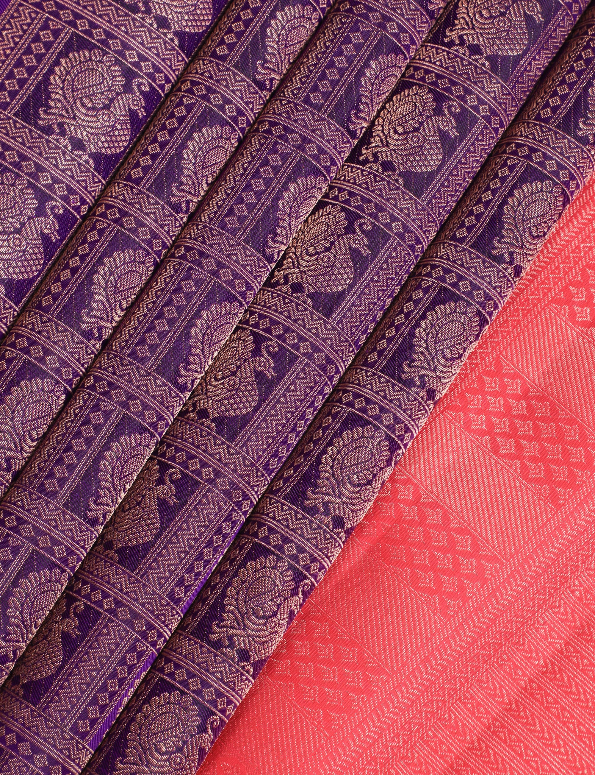 Purple and red Kanchipuram silk sarees with intricate zari patterns and traditional designs